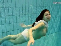 CrocoList presents: Girl in white panties swims in pool