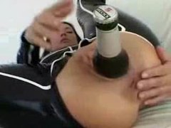 CrocoList presents: Chick in latex puts a beer bottle in her ass