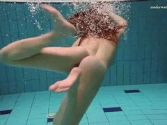 CrocoList presents: Underwater with a busty naked babe as she swims