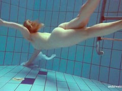 CrocoList presents: Redhead goes for a nude swim in the pool