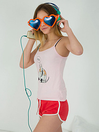 CrocoList presents: This doll really knows how to have fun with her and how she can show off her pussy and listen to some beats at the same time.
